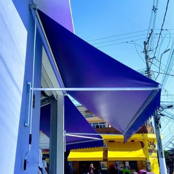 Toldo Cortina com Braços Laterais em Monte Alegre, Nova Odessa - SP — Instalação em garagem residencial
